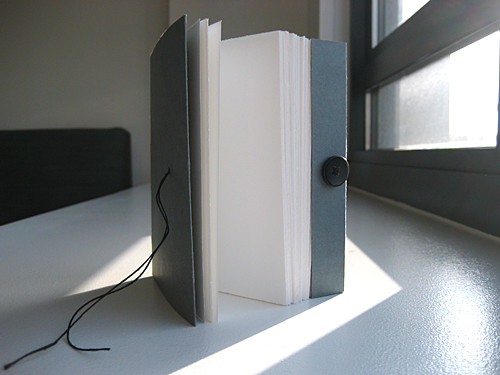 Front view with book open, showing pages