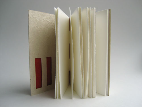 Inside view, showing page edges and cut-outs in the front of the cover.