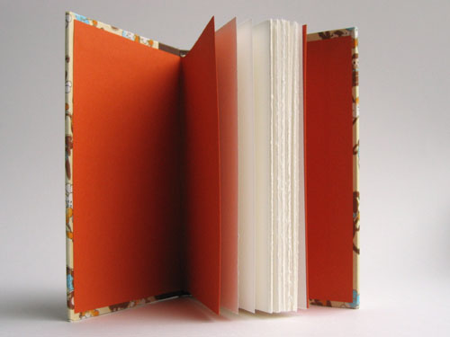 Inside view: White pages, orange endsheets