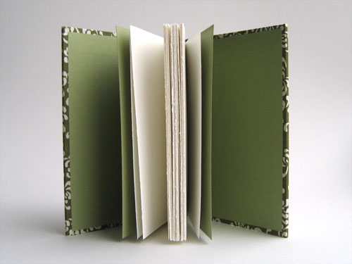 Inside view: White pages, light green endsheets
