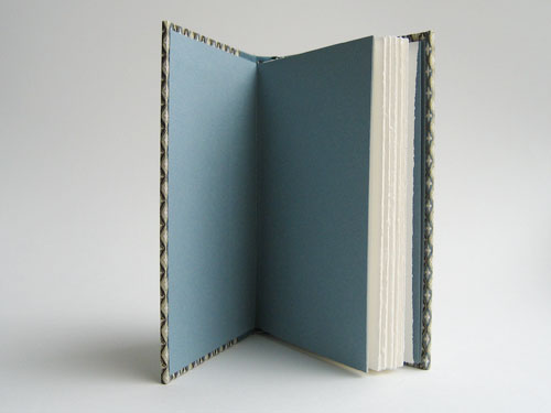 Inside view: White pages, light blue endsheets