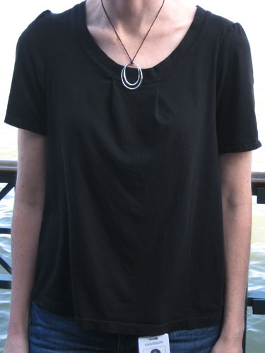 Black pleated top on a headless me