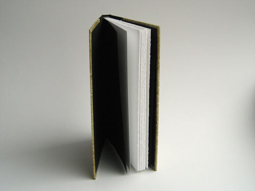 Open cover view: black end papers