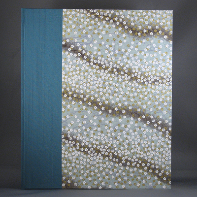 Cased-in 8x10 inch photo album covered with a floral Japanese Chiyogami paper and raw silk bookcloth
