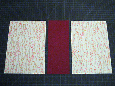 Decorative paper and book cloth, cut in preparation for covering the case