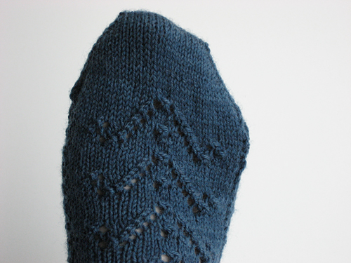 Detail view of the chevron lace repeating up the top of the sock