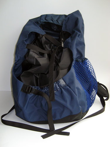 The front view of a blue and black backpack with mesh pockets on each side. The interior bag is strapped inside the shell by buckled webbing.