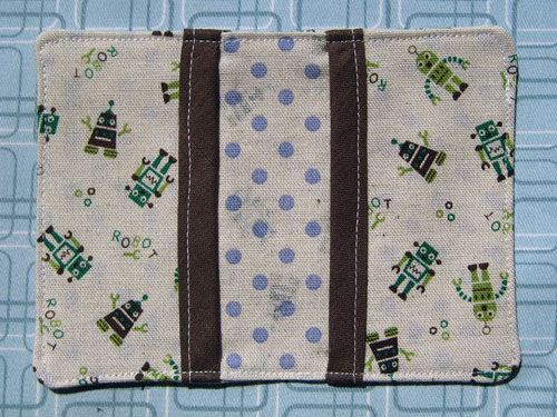 The inside of the wallet, showing the pockets and contrasting lining fabric.