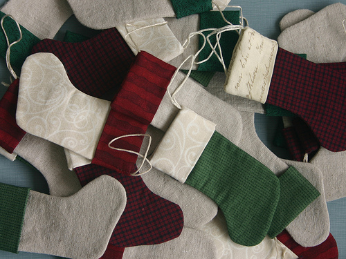 A pile of green, red and white stocking ornaments