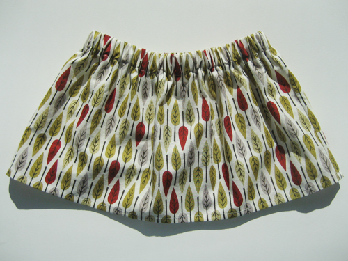 Gathered skirt with repeating leaf pattern in autumnal colors
