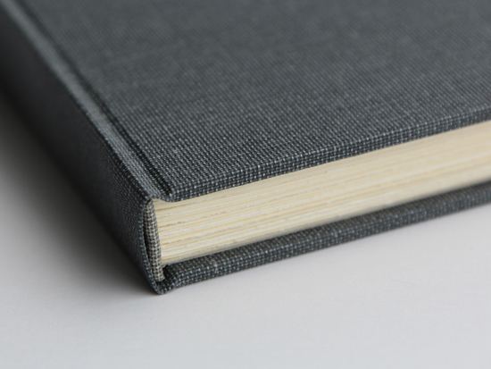 Spine detail of dark gray full cloth book