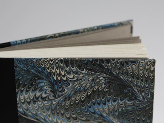 Detail of fore edge and blue marbled cover paper
